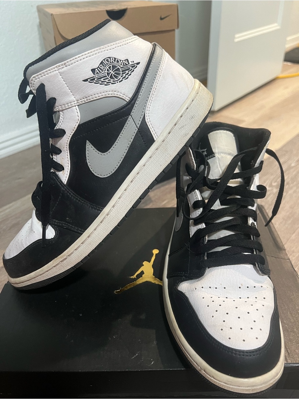 Jordan Black and White Mid-Top Sneakers